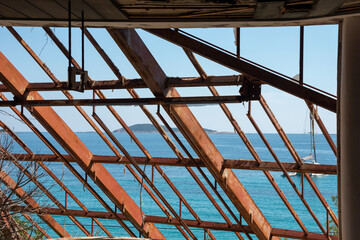 View from the destroyed window on the Adriatic Sea. Abandoned tourist resort in Kupari, Croatia.