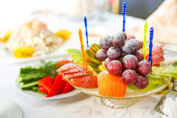 fruit dish is on festive table close up with soft focus