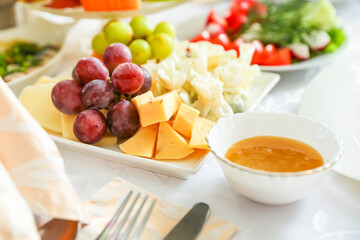 cheese plate is on festive table close up with soft focus