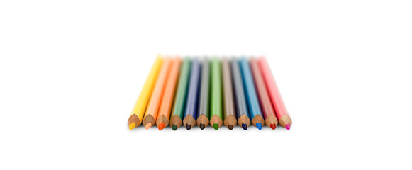 multicolored pencils lie on a white background. front view