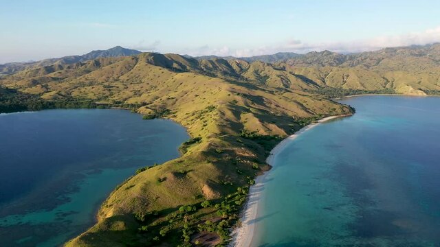 Loho Gebah Bay and peninsula in north Komodo Island Indonesia, Aerial pan right shot