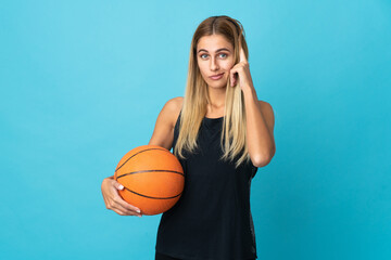 Young woman playing basketball  isolated on white background thinking an idea