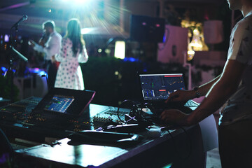 Fototapeta na wymiar DJ plays at the party. DJ console. professional equipment for fun parties