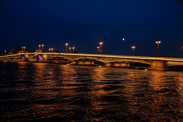 Night view of the Neva River and the bridge in St. Petersburg