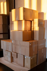 Cardboard boxes in the sun in a darkened room.