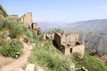on the narrow street of abandoned ancient village Gamsutl in Dagestan