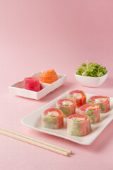 sushi, sushi salad, pink background. japanese food