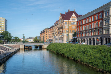Fototapeta na wymiar Canal view of Malmo and old buildings - Malmo, Sweden