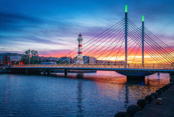 Malmo Old Lighthouse and University Bridge at sunset - Malmo, Sweden © diegograndi