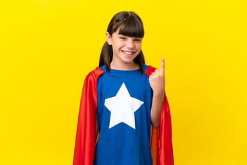 Little super hero kid isolated on purple background pointing with the index finger a great idea