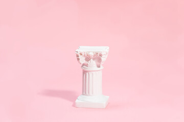 Product display with white roman column in minimalism style on a pink background. Perfect for beauty products or jewellery.