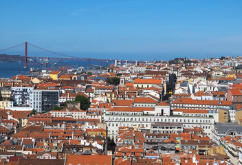 Fototapeta na wymiar Lisbon, Portugal: Aerial view of Lisbon with red bridge of 25 april at Tejo river