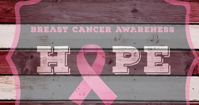 Animation of pink ribbon logo with breast cancer text over wooden background