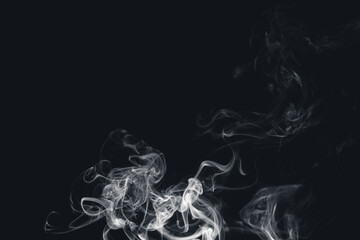 White smoke creating abstract shapes on a black background