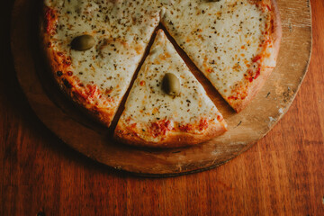 close-up mozzarella pizza with olives