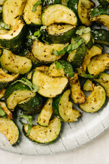 Overhead closeup of fried zucchini with basil