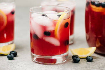Blueberry lemonade cocktails with blueberries and lemons
