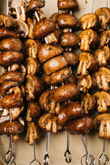 Marinated Cremini mushrooms on skewers