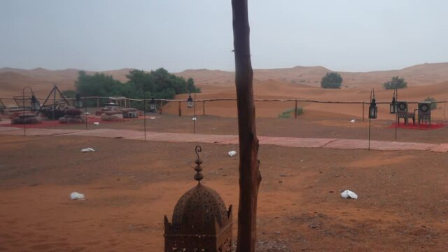 Rain and storm in the Sahara desert, seen from inside a luxury camp te