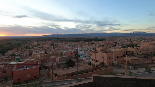 Rotation Timelapse at sunrise over a pink arabic city, Morocco on a su