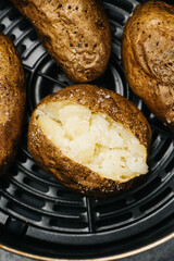 Closeup of a split open air fryed baked potato