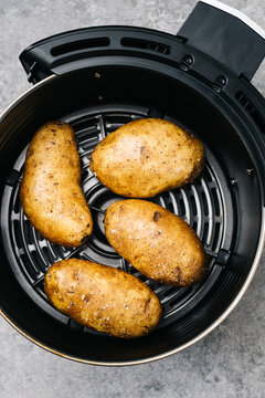 Whole Raw Golden Potatoes In An Air Fryer