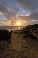 unas vistas de la bella playa de Mazagon, situada en la provincia de Huelva,España.Con sus acantilados,pinos,dunas ,vegetacion verde y un cielo con nubes. Atardeceres preciosos