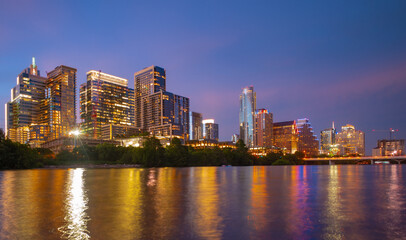 Beautiful Austin skyline. Austin, Texas on the Colorado River. Night sunset city. Reflection in water.