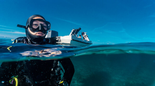 diver ready to descend into the ocean at Raja Ampat