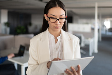 Asian businesswoman using digital tablet