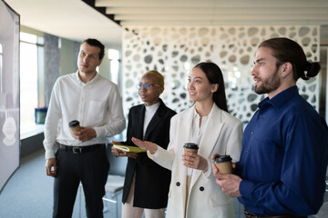 Asian woman with colleagues talking during online meeting