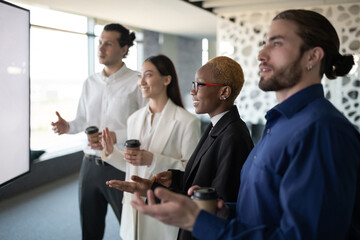 Positive diverse team having online meeting