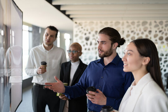 Young manager talking during video conference with colleagues