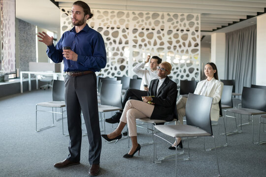 Young manager talking during video conference in office