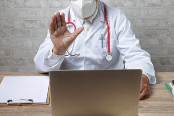 Patient doctor consultant using video chat in clinic.