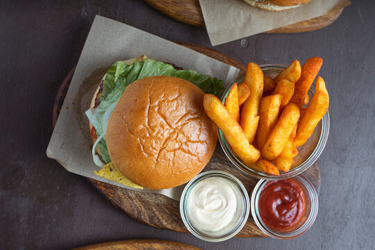 Aerial view of hamburger with french fries on restaurant table