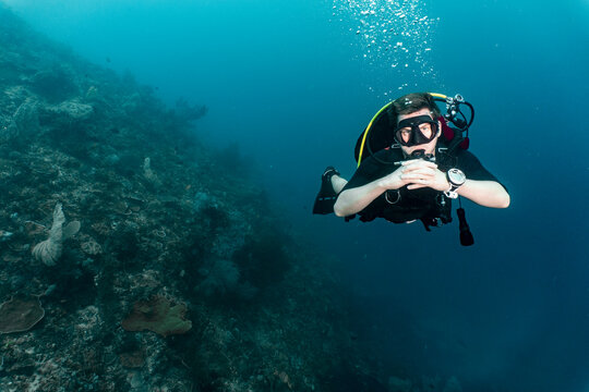 diver floating and exploring the ocean at Raja Ampat
