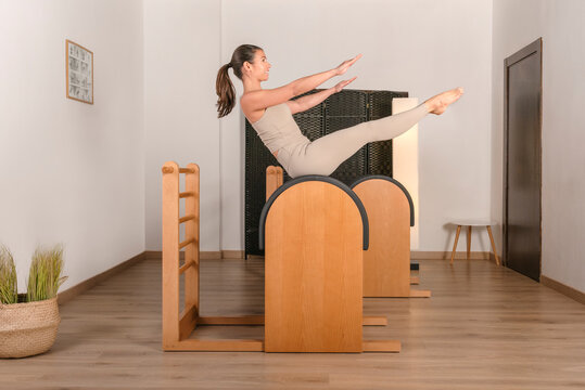 brunette girl doing pilates exercise teaser