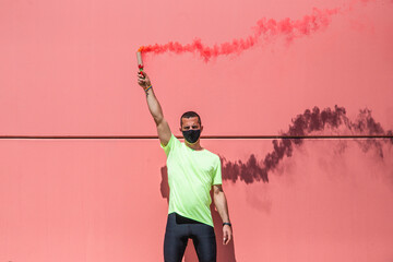 Runner holds a red smoke grenade