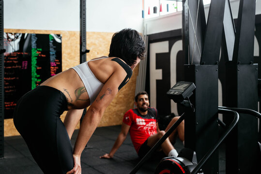 A woman feeling exhausted after training hard.