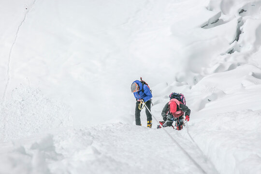 Climbers navigating a glacier in Nepal