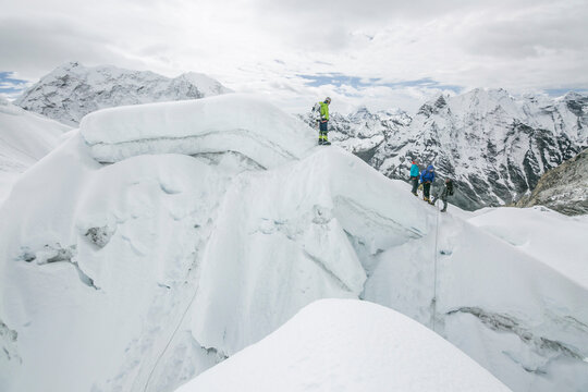 Climbers on a ridge line in Nepal