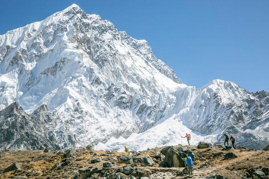 Climbers en route to Everest Basecamp, Nuptse in the background