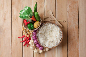 Vegetable in basket for di cut,wooden background.