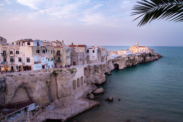 scenic sunset view over historic old town and church of San Francesco, Vieste, Gargano, Apulia, Italy