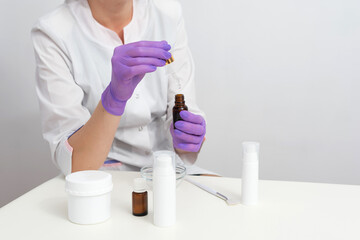 Formulating and mixing skincare for individual use. Cosmetic blank bottle containers and scientific glassware. Research and develop beauty product concept.