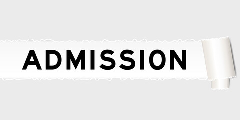 Ripped gray paper that have word admission under torned part