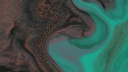 Teal mint turquoise and brown liquid paint with shiny particles mixed background. Macro shot