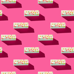 Photo in the form of a seamless pattern. Gray pastille with colored splashes with shadows on a colored pink background. High quality photo