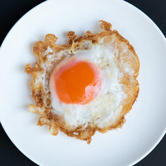 Thai-style fried duck egg. Crispy on egg white and juicy on egg yolk